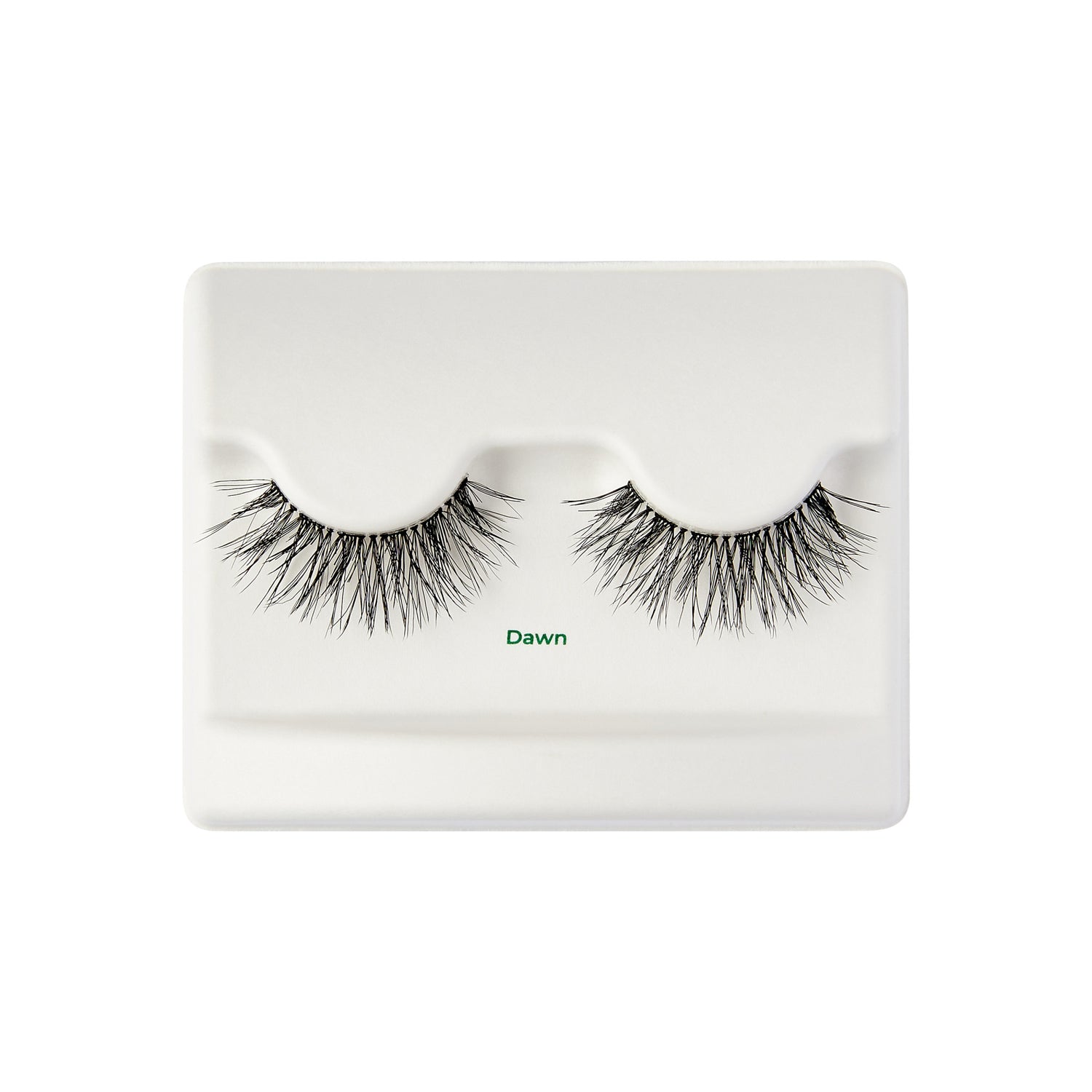 The image shows a pair of false eyelashes displayed on a white plastic tray. The eyelashes are thick and voluminous, with a wispy, natural look. The tray has two indentations where the eyelashes are placed, and the word "Dawn" is printed in small green text below the eyelashes. The overall presentation is clean and minimalistic.