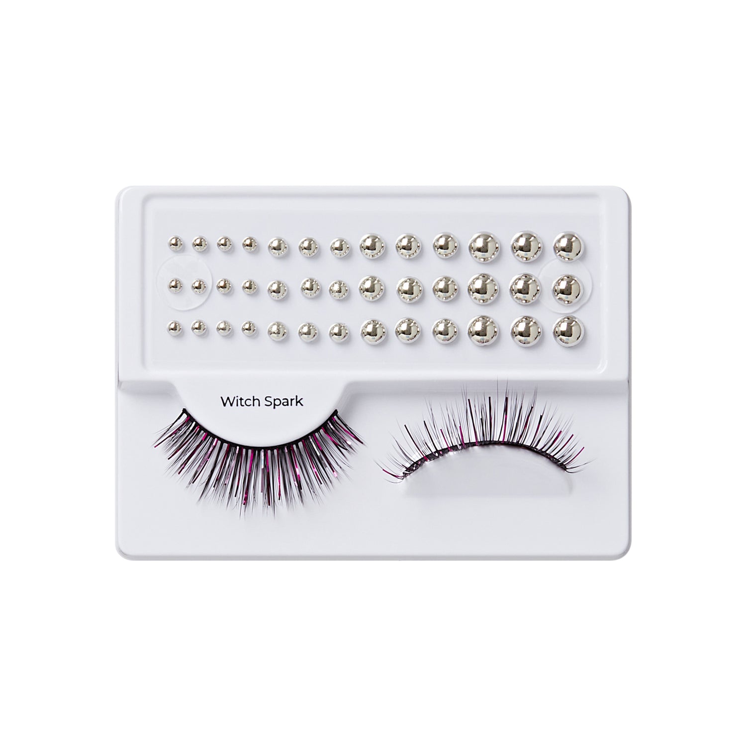 Witch Spark false eyelashes with rhinestone embellishments on white palette tray