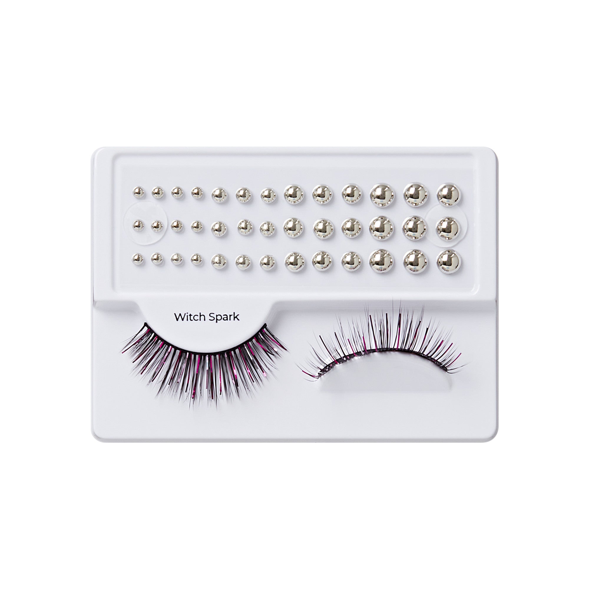 Witch Spark false eyelashes with rhinestone embellishments on white palette tray