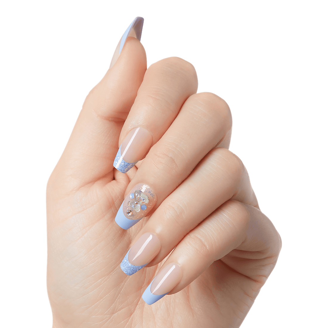 Hand displaying KISS Majestic Dream press-on glue nails in soft nude with light blue glitter French tips, and one accent nail with rhinestones and blue embellishments.