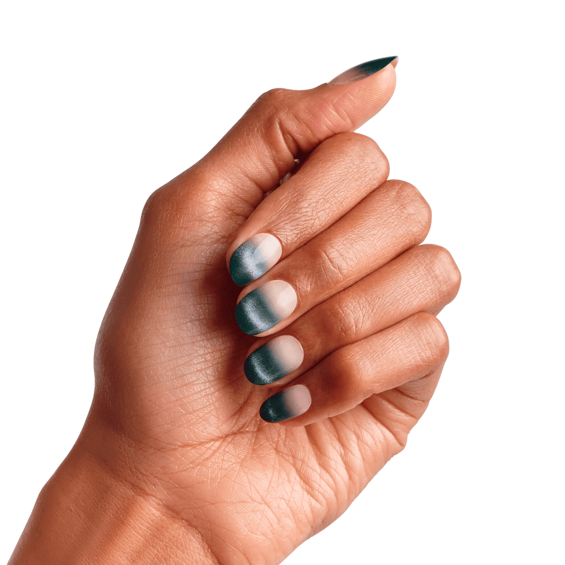 Hand with medium brown skin tone displaying matte ombre press-on nails in teal and soft pink shades, showing short to medium almond shape.