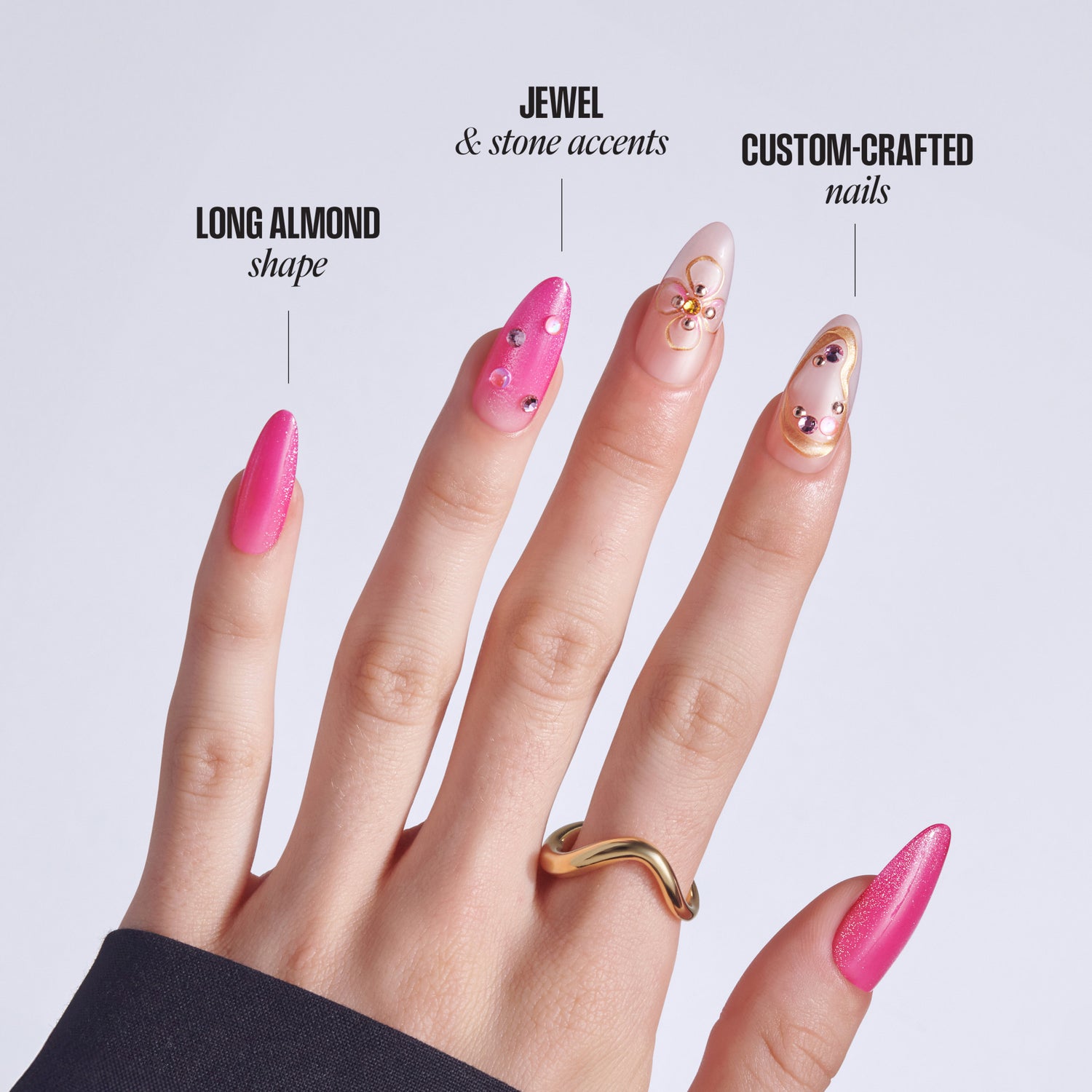 Four manicured nails displaying long almond shape, jewels, stone accents, and custom-crafted designs in pink and nude tones.