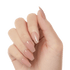 Hand with long, coffin-shaped press-on gel nails in soft nude beige shades, showing a natural glossy finish.