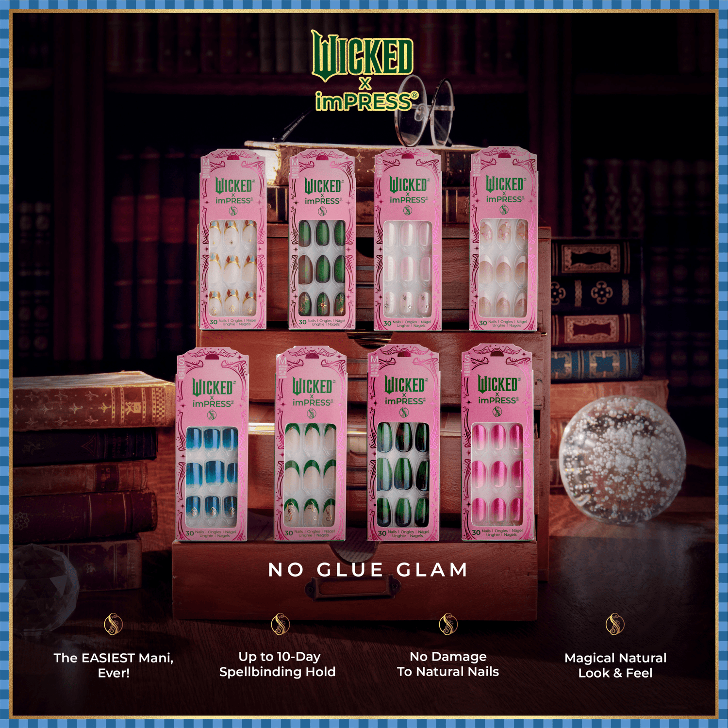 Eight pink-packaged Wicked x imPRESS press-on nail sets displayed on a wooden stand with a vintage book backdrop, showcasing various nail designs and the tagline \