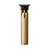 Sleek gold-colored cordless trimmer with textured grip and black precision blade at the top, featuring a circular power button near the top center.