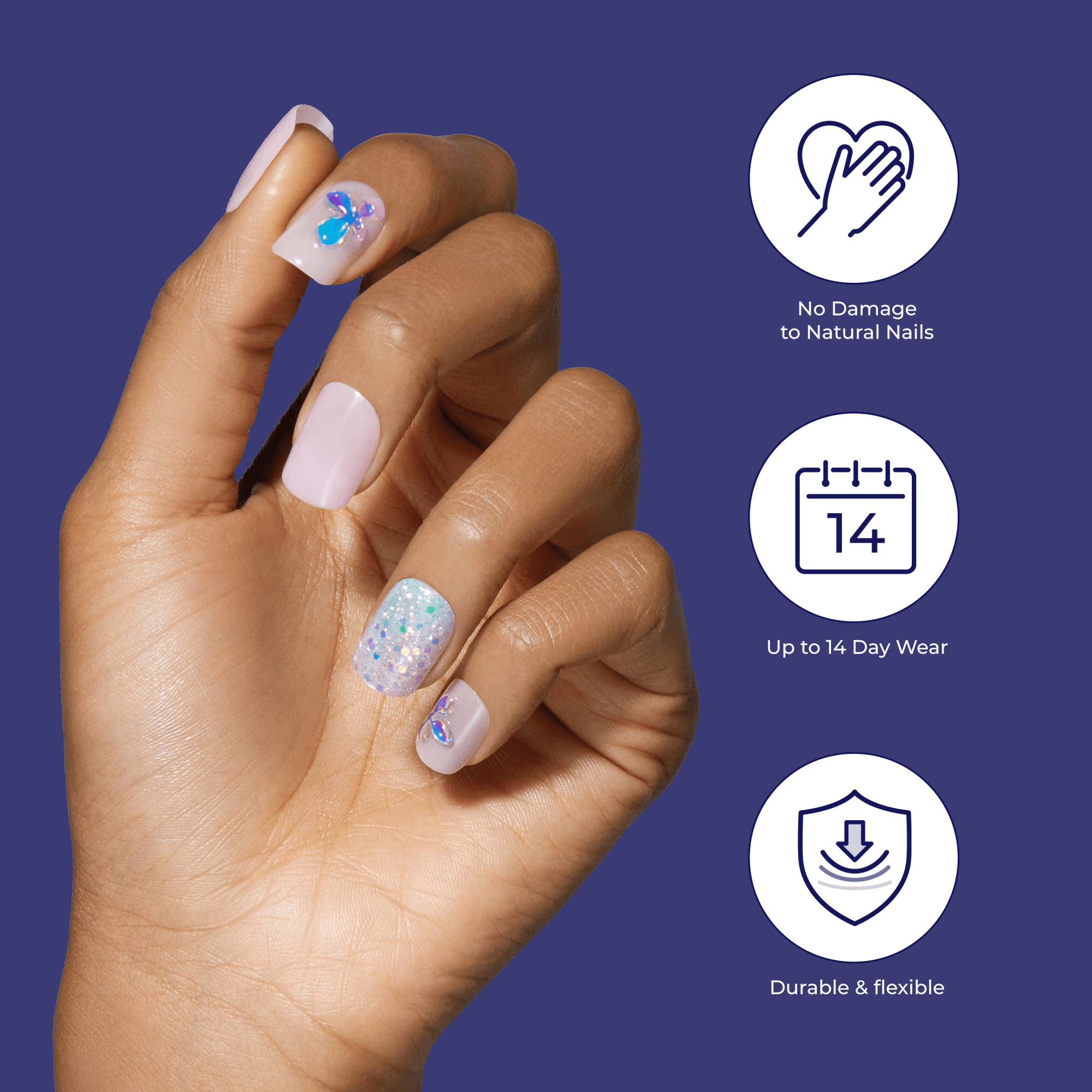 Hand with medium brown skin tone showing five press-on nails in pale pink with two featuring blue and purple butterfly designs, and one white glitter nail. Text icons highlight \
