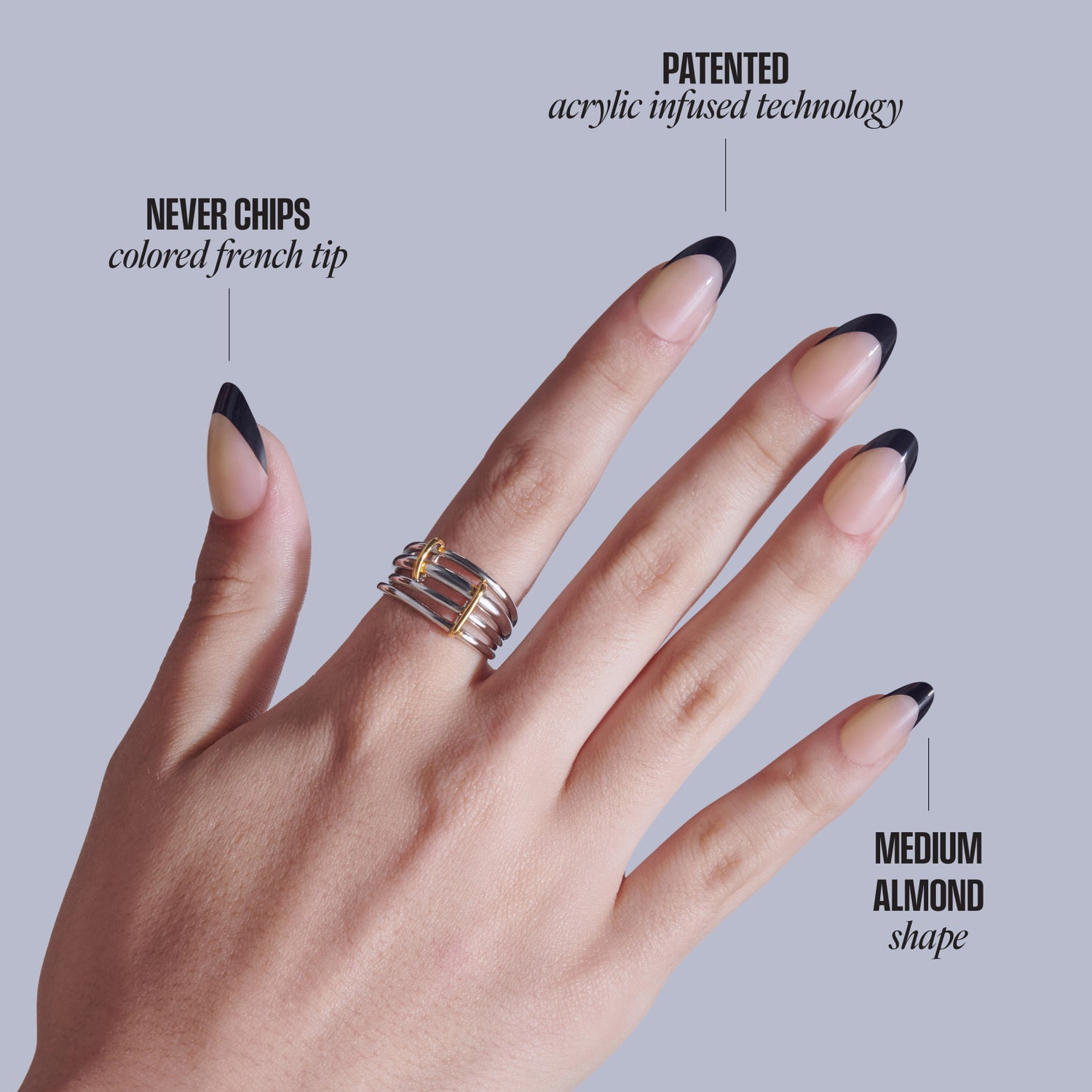 Hand displaying acrylic nails with black French tips, medium almond shape, and decorative ring.