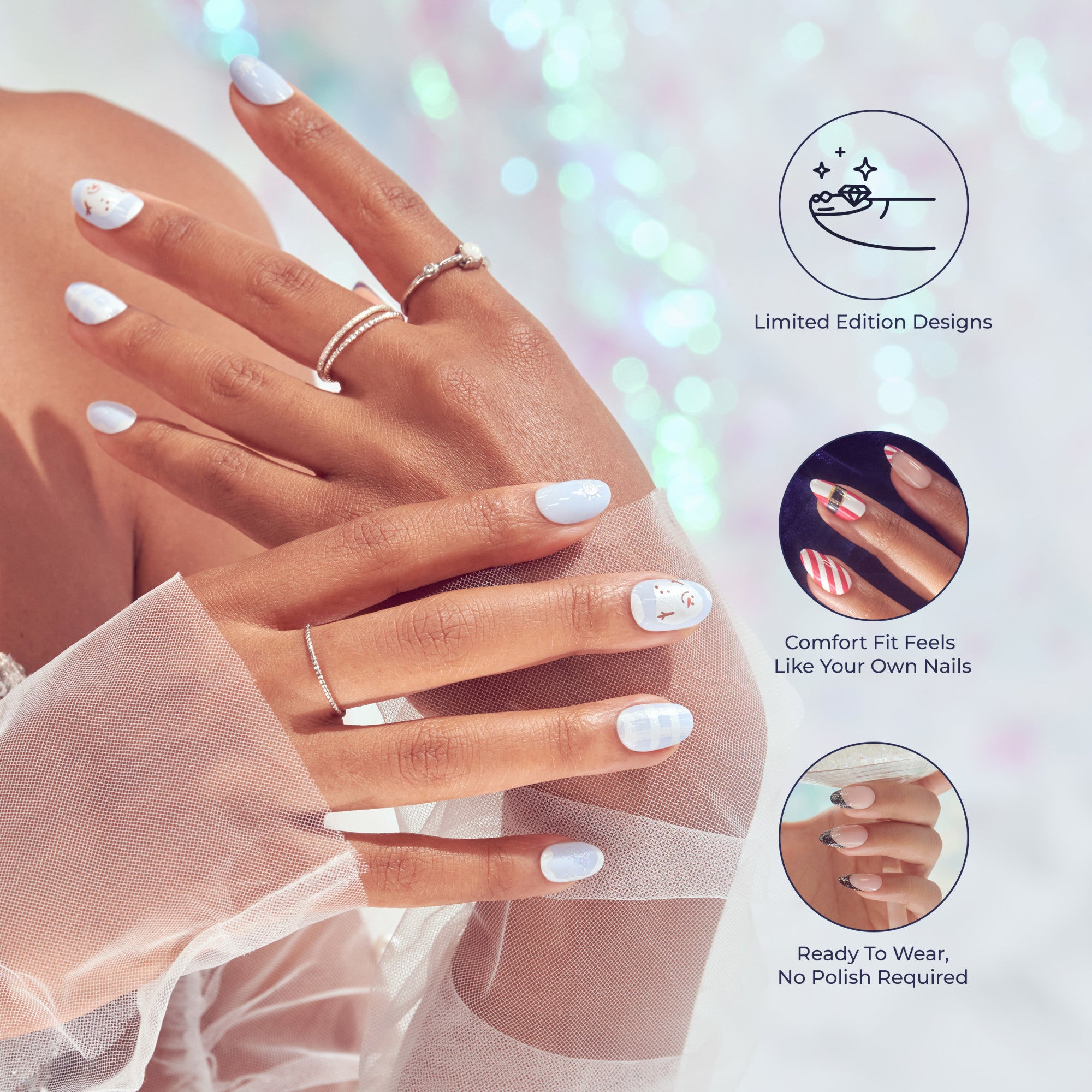 Hands with light blue and white holiday-themed press-on nails featuring snowmen and checkered designs, wearing delicate silver rings. Text highlights limited edition designs, comfort fit like natural nails, and no polish required.