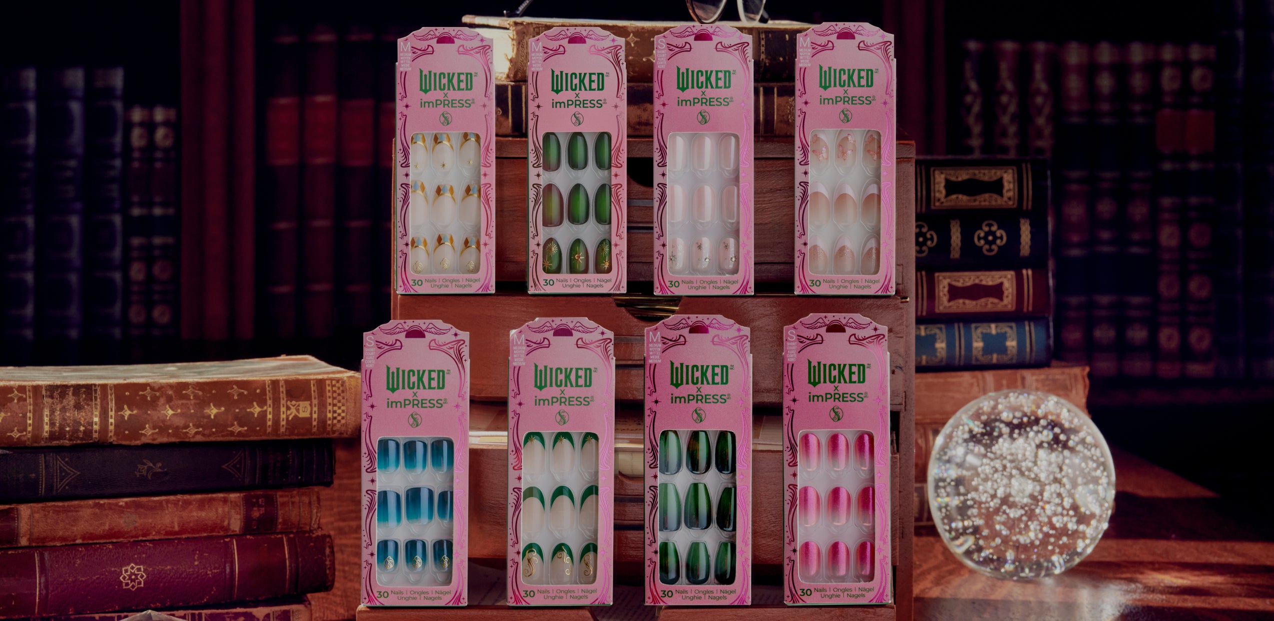 Wicked imPRESS nail sets displayed on wooden shelf with vintage books and pearl ornament.