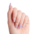 Hand with almond-shaped nails featuring a nude base and lavender tips, one nail with a lavender gradient and another decorated with a gold star design and a small gem.