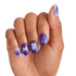 Hand with medium-length nails painted in purple and lavender gradient, featuring white silhouettes of a butterfly, a witch hat, and a magic wand with sparkles.