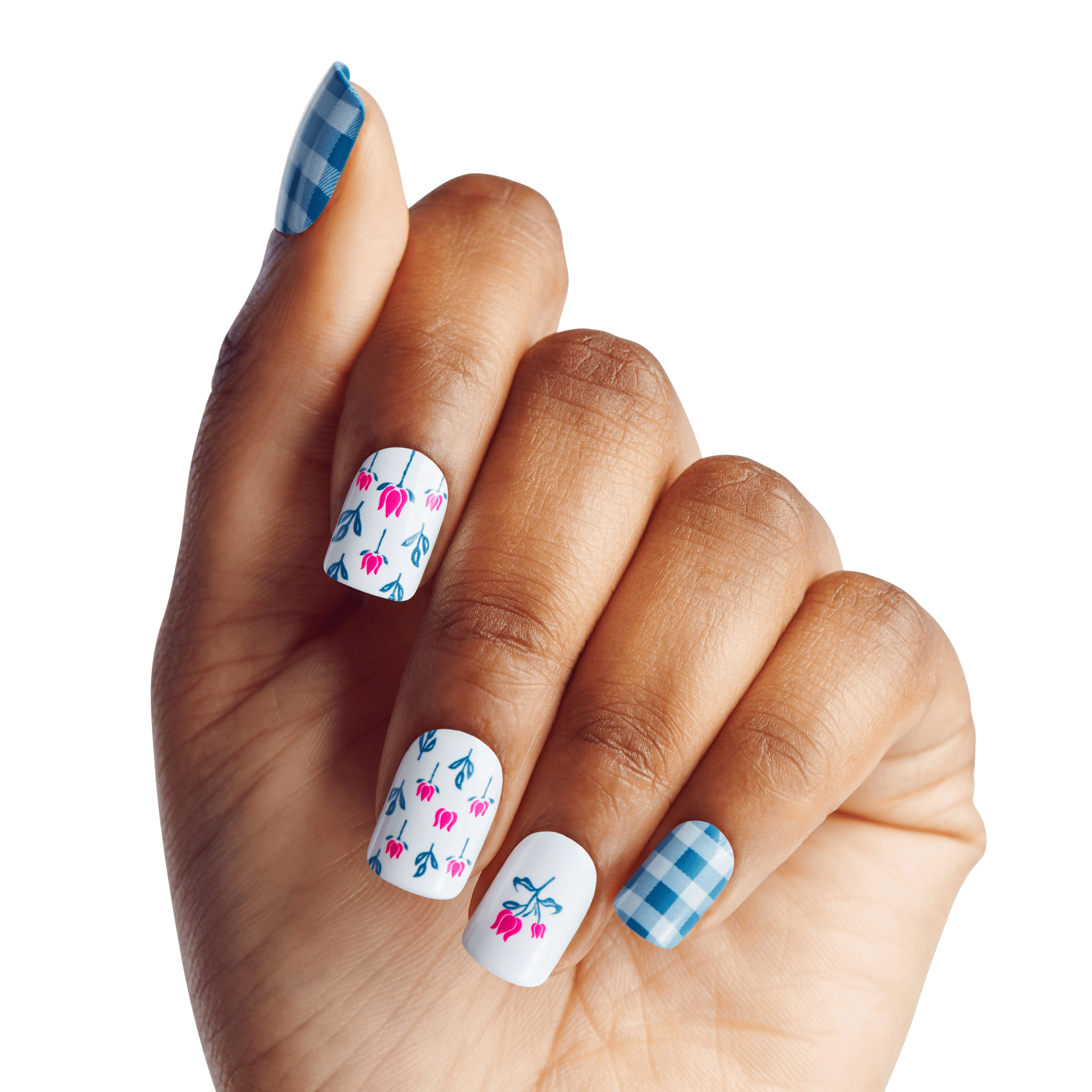 Hand with nails painted in a WICKED X KISS Marvelous Munchkinland design, featuring blue gingham pattern on pinky and thumb, and white background with small blue and pink floral motifs on middle three nails.