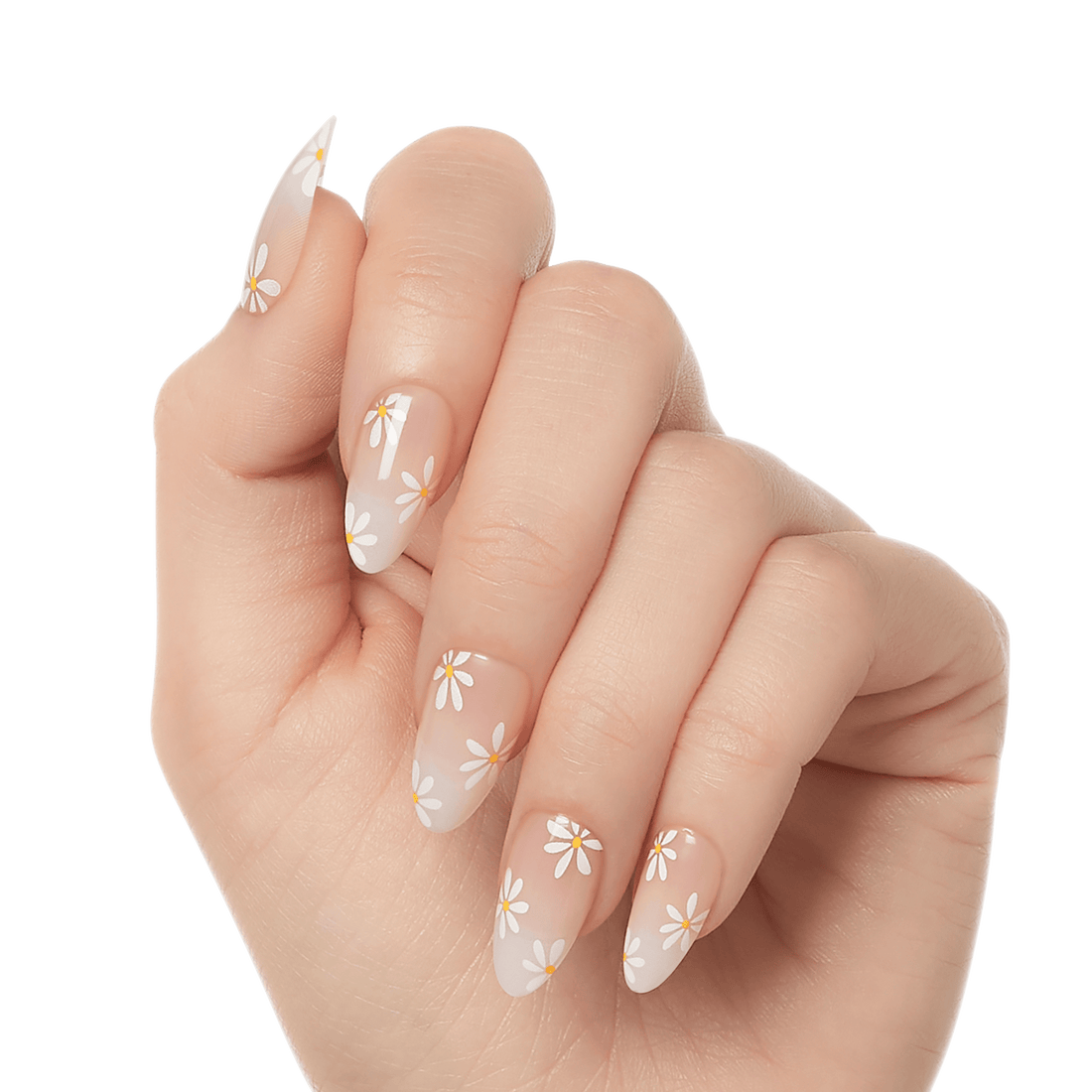 Hand showing almond-shaped press-on gel nails with a natural pink base and white daisy flowers with yellow centers as the design.