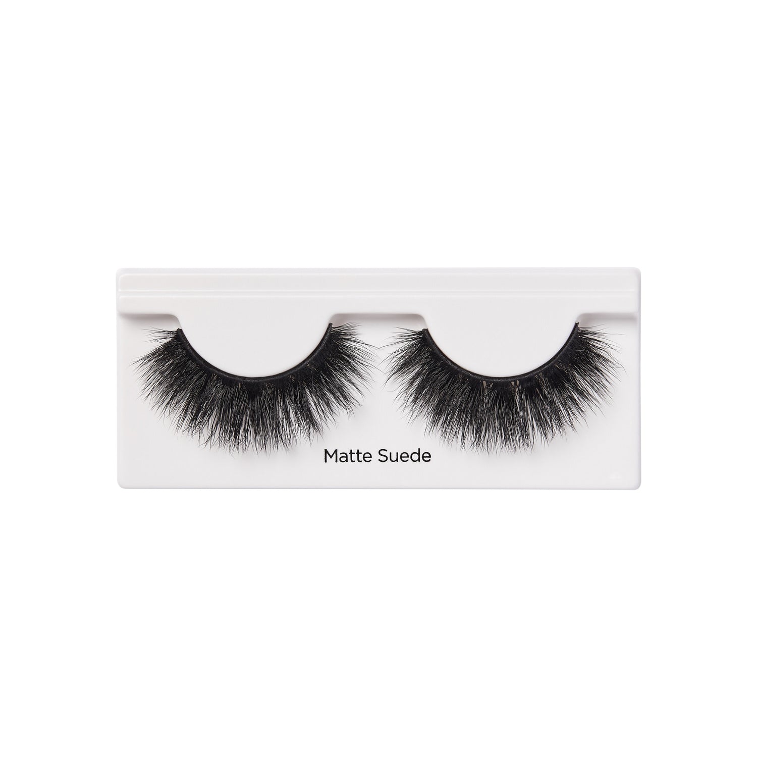 Matte Suede false eyelashes in white packaging with black lashes displayed