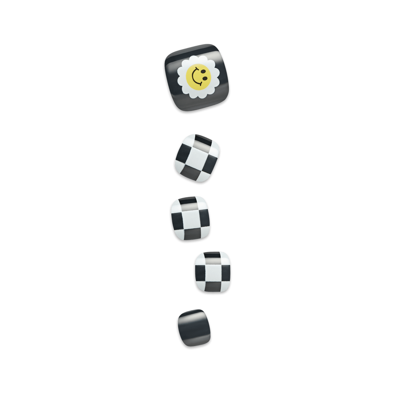 Five press-on toenails in black and white designs, featuring a smiling yellow daisy on the largest nail and black-and-white checkered patterns on the others.