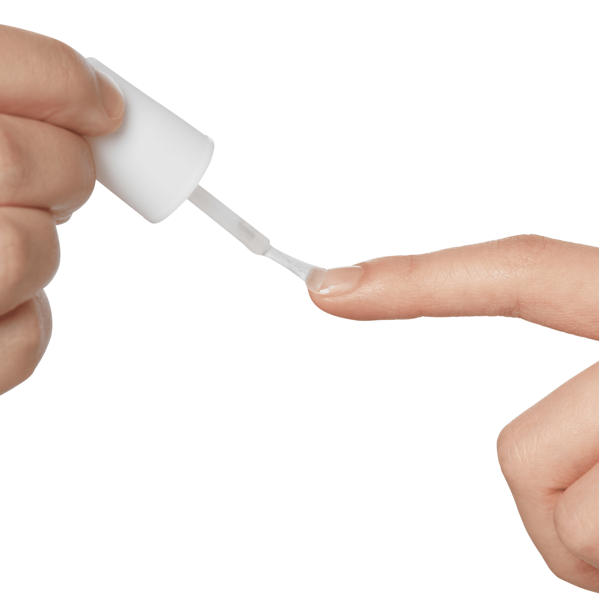 Hand holding a white brush applicator applying clear glue to the fingernail of another hand&
