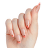 Hand with almond-shaped nails painted in nude pink with coral tips and thin metallic gold stripes along the edges.