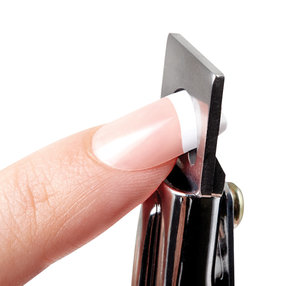 Close-up of a metal nail tip clipper trimming a white-tipped artificial nail extension on a natural fingernail against a white background.