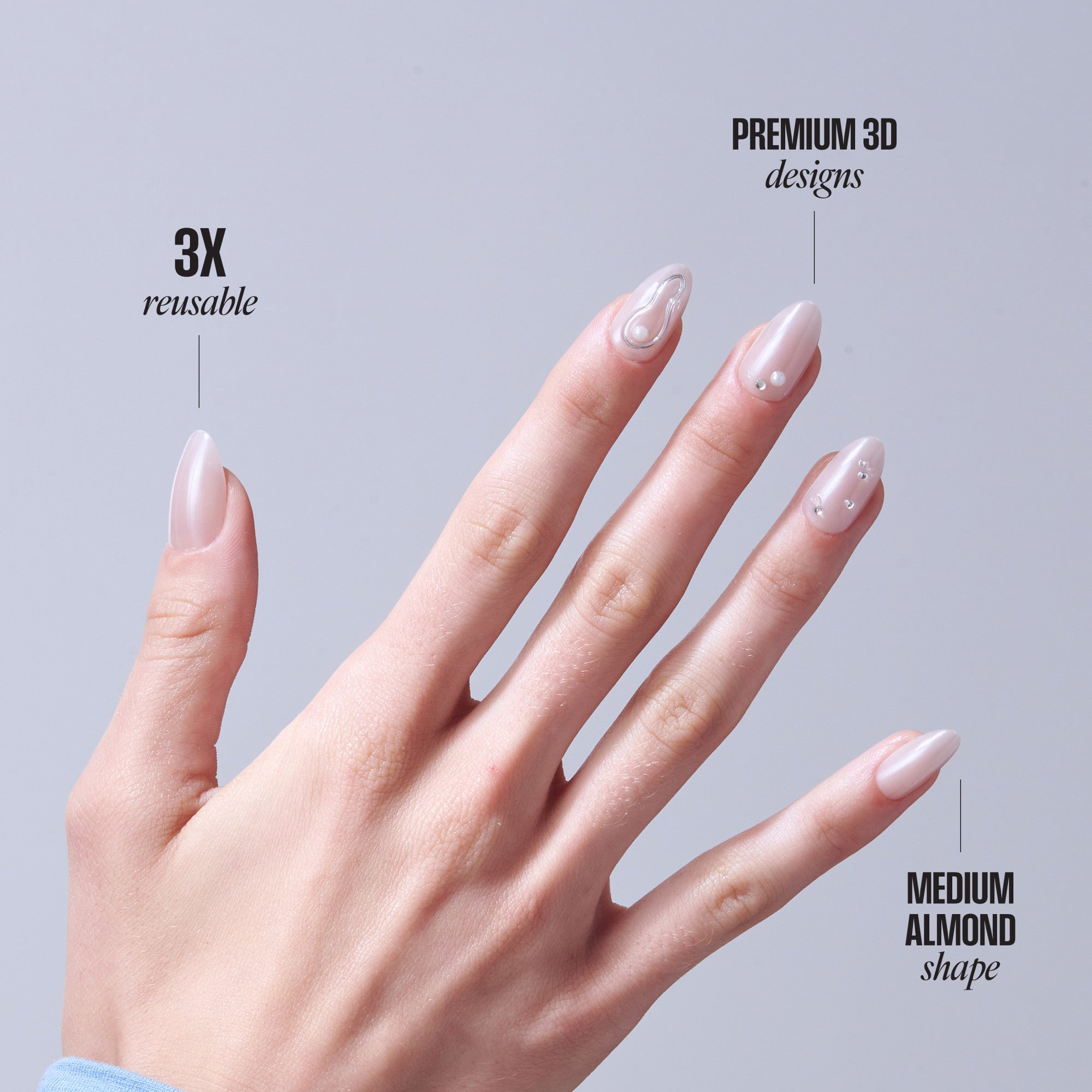 Reusable press-on nails in medium almond shape with 3D premium designs in nude pink.