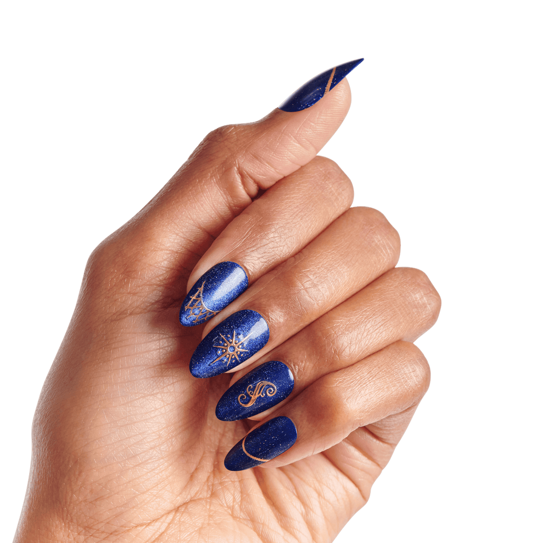 Hand with long, pointed nails painted in shimmering deep blue with gold celestial and abstract line art designs on each nail.