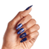Hand with long, pointed nails painted in shimmering deep blue with gold celestial and abstract line art designs on each nail.