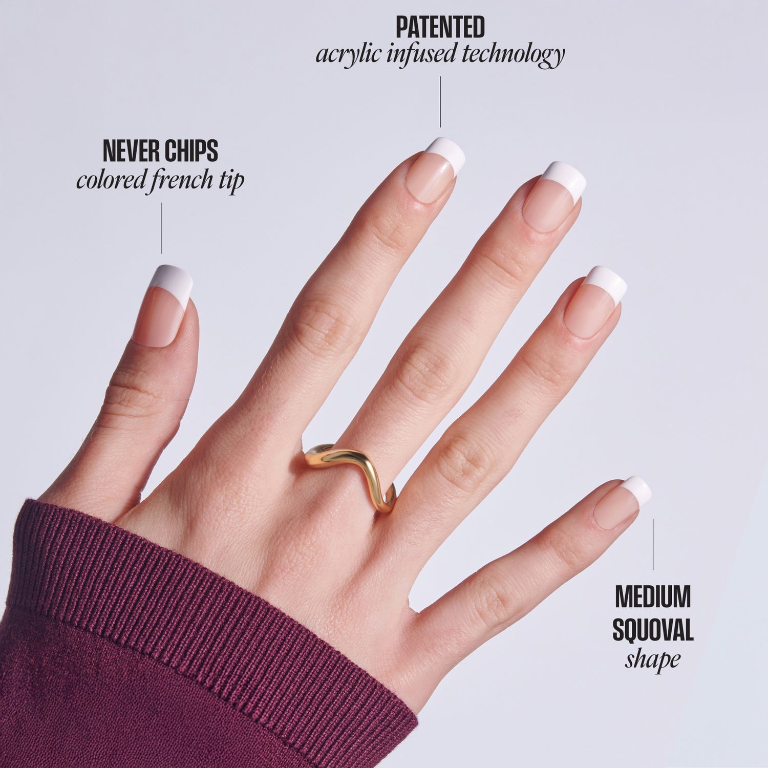 Manicured hand displaying acrylic nails with white French tips and medium squoval shape.