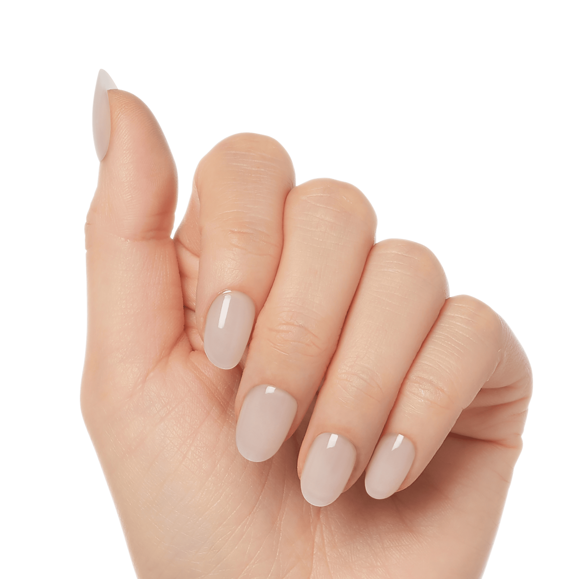 Hand with natural-looking, oval-shaped press-on gel nails in a soft nude beige color, shown from a side angle with fingers slightly curled.