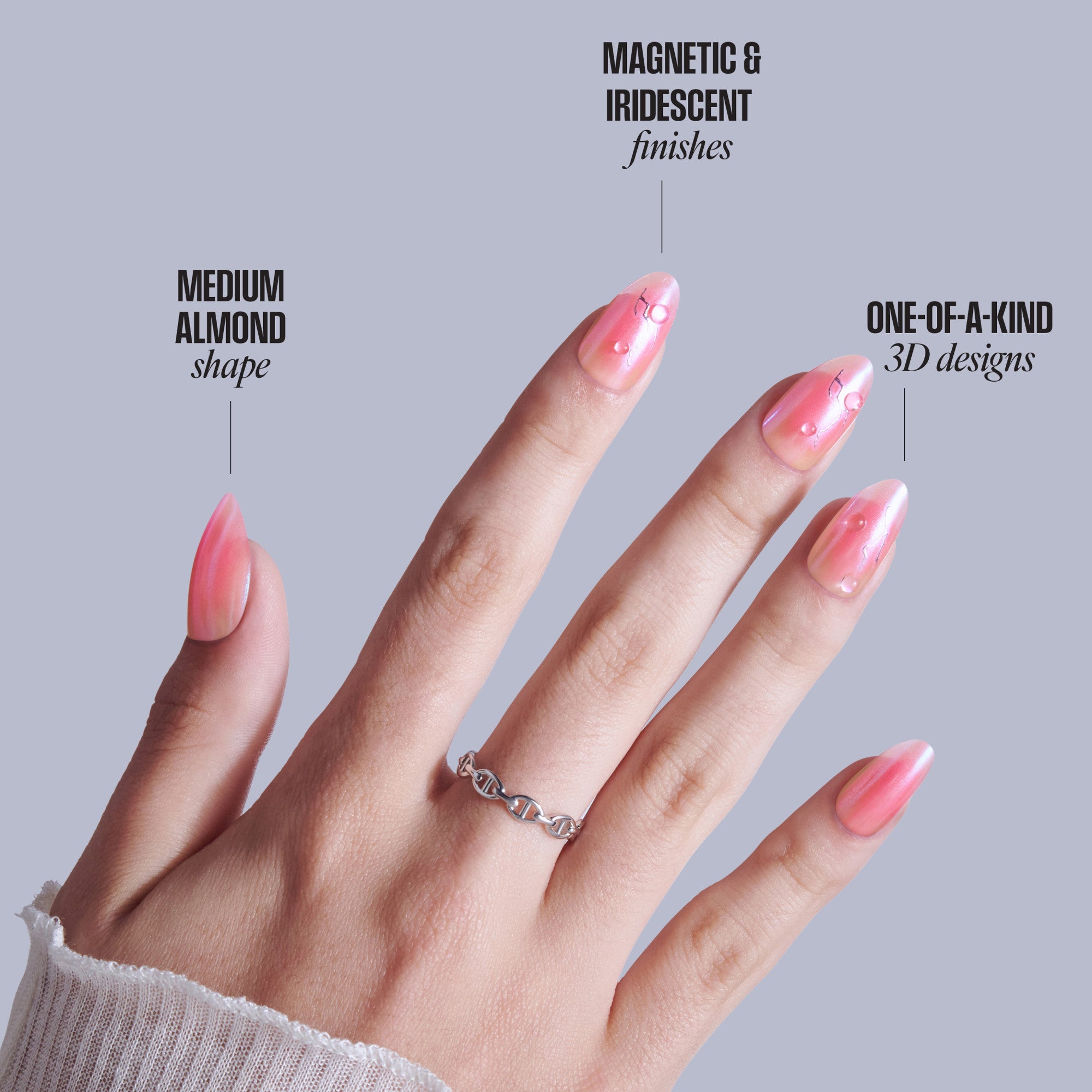 Almond-shaped pink nails with magnetic iridescent finish and 3D bubble designs