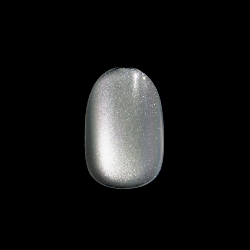 Single press-on nail shown against black background with a metallic silver finish that has subtle holographic shimmer.