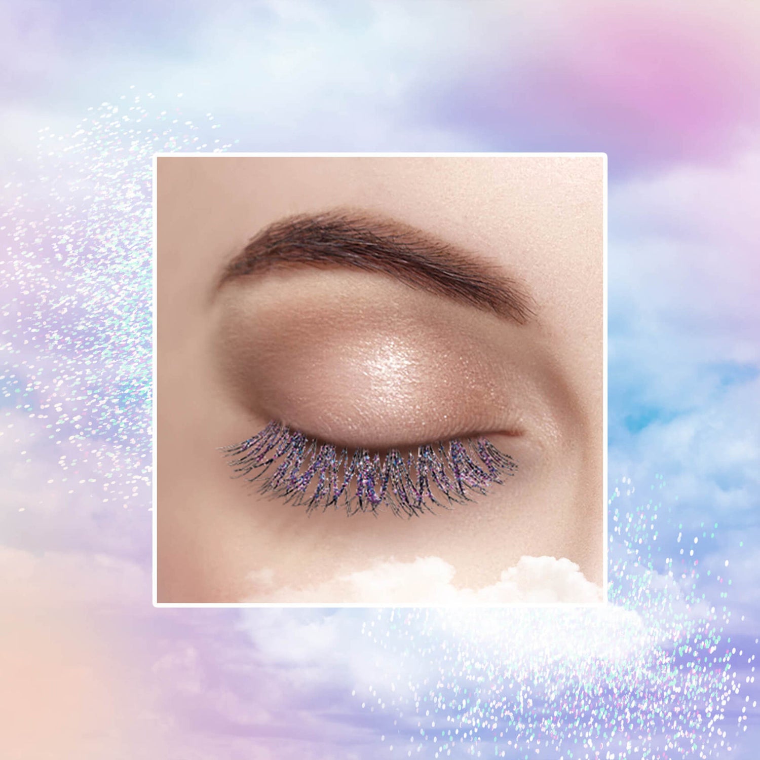Close-up of a closed eye with dark brown eyebrow and glittery false eyelashes in purple and black, set against a pastel cloud and sparkle background.