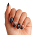 Black and nude ombre nails with glitter accents on model hand