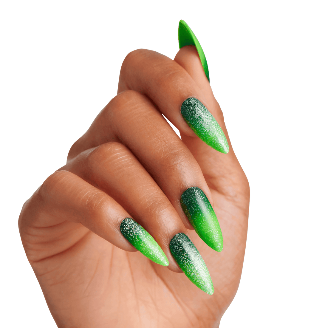 Hand with long stiletto-shaped nails featuring a green ombre design with dark green at the base fading to bright green tips, accented with silver glitter.