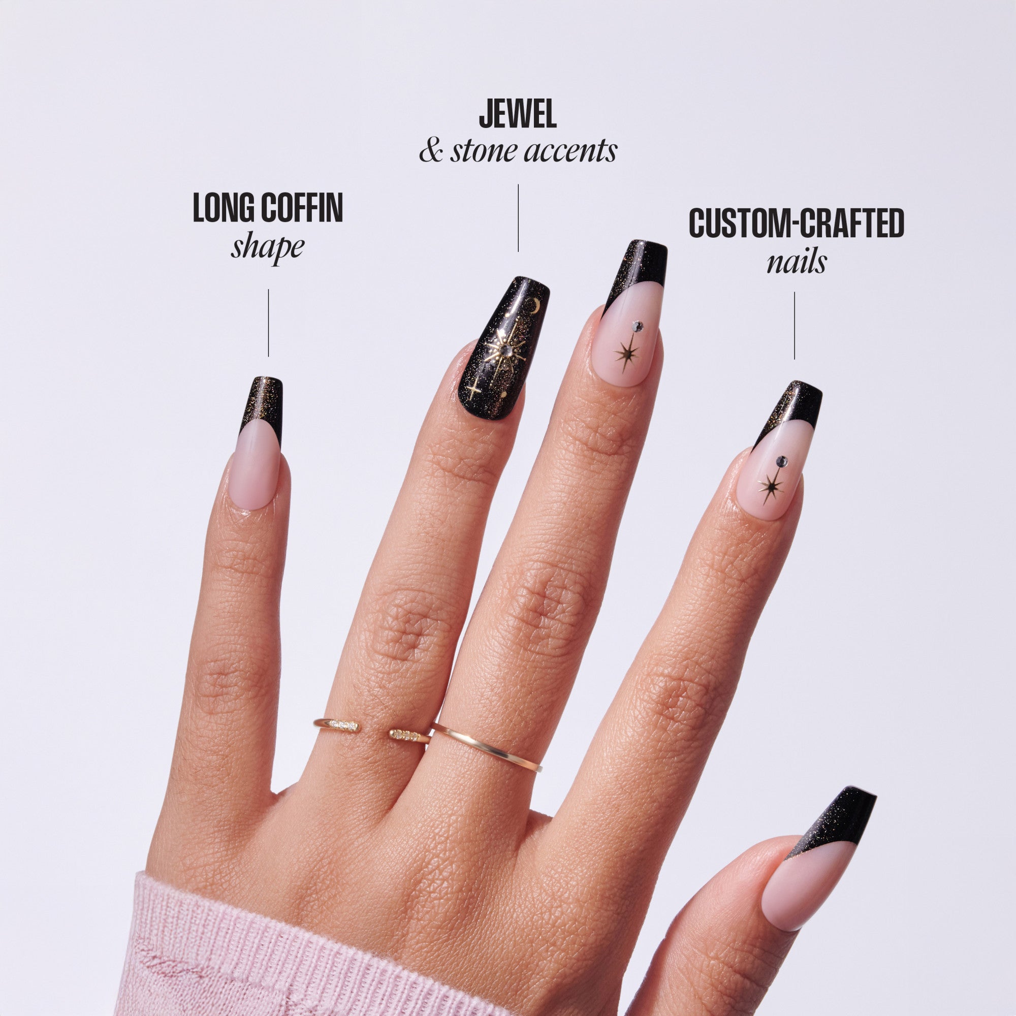 Manicure showcase: long coffin nails with black glitter tips, jewel accents, and custom star designs.