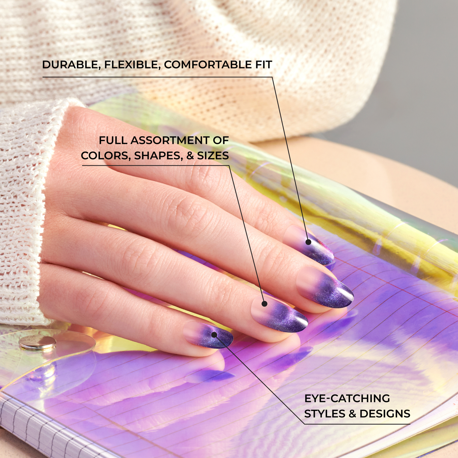 Hand with purple ombre press-on nails resting on a shiny, iridescent purple notebook, overlaid with text highlighting durability, variety, and stylish designs.