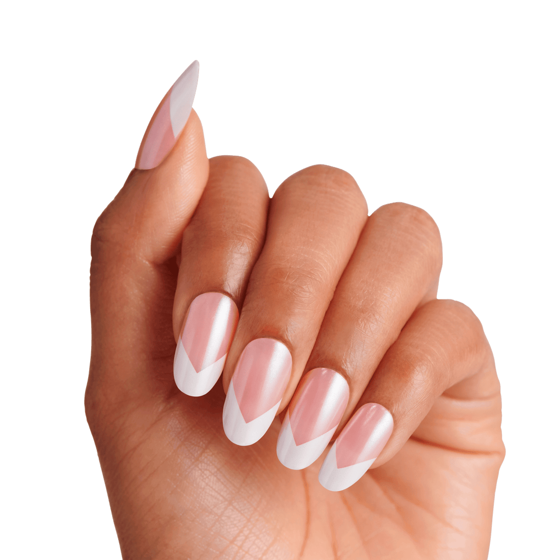Hand with almond-shaped, press-on nails featuring a pink base and white chevron tips, showcasing the KISS X WICKED: FOR GOOD Good News Glinda nail design.