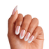 Hand with almond-shaped, press-on nails featuring a pink base and white chevron tips, showcasing the KISS X WICKED: FOR GOOD Good News Glinda nail design.