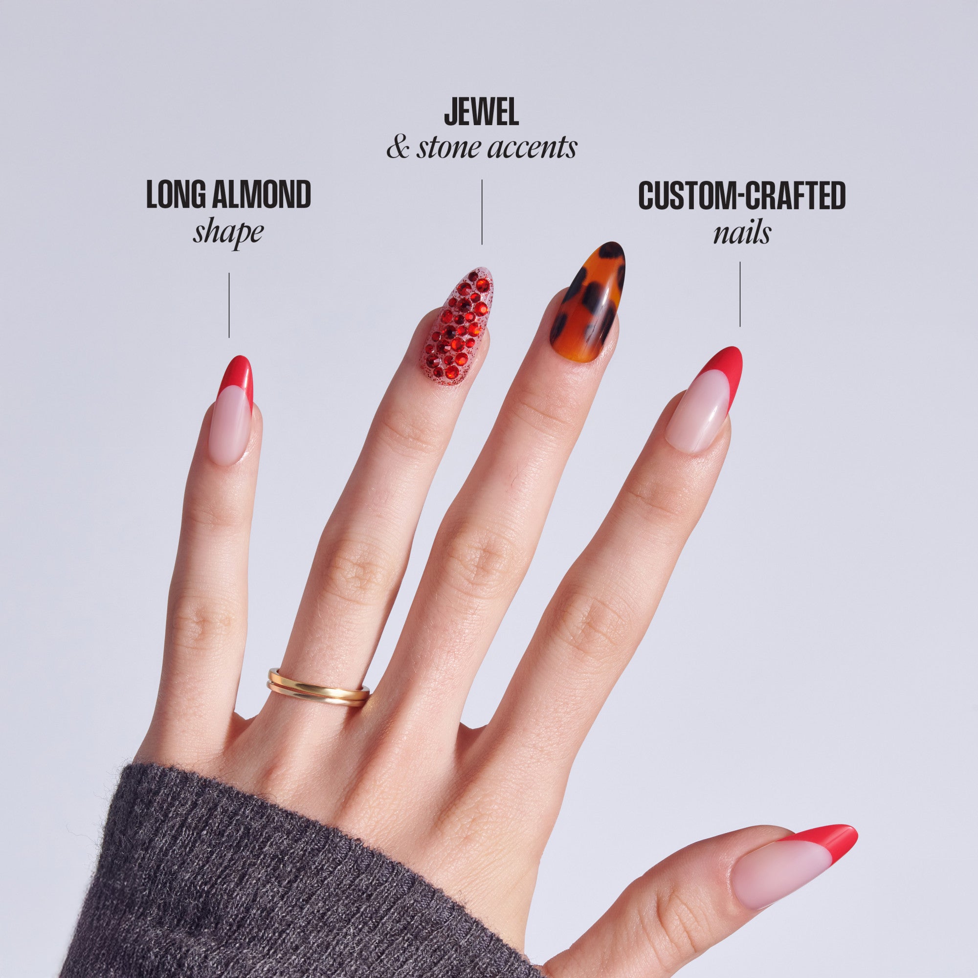 Four nail designs featuring long almond shape, jewel accents, and custom-crafted styles in red tones.