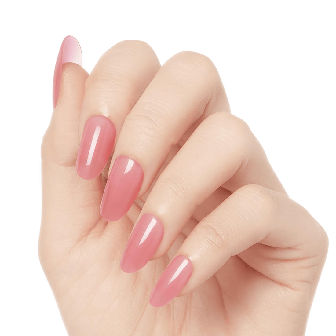 Hand with glossy, almond-shaped press-on gel nails in a muted rosy pink shade, shown from a slightly angled side view.