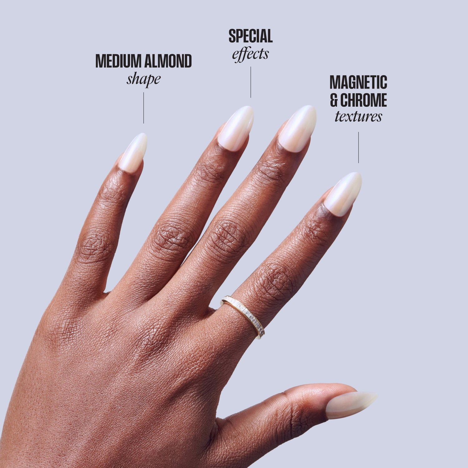 Medium almond nails with white tips, magnetic chrome texture, displayed on brown skin hand.