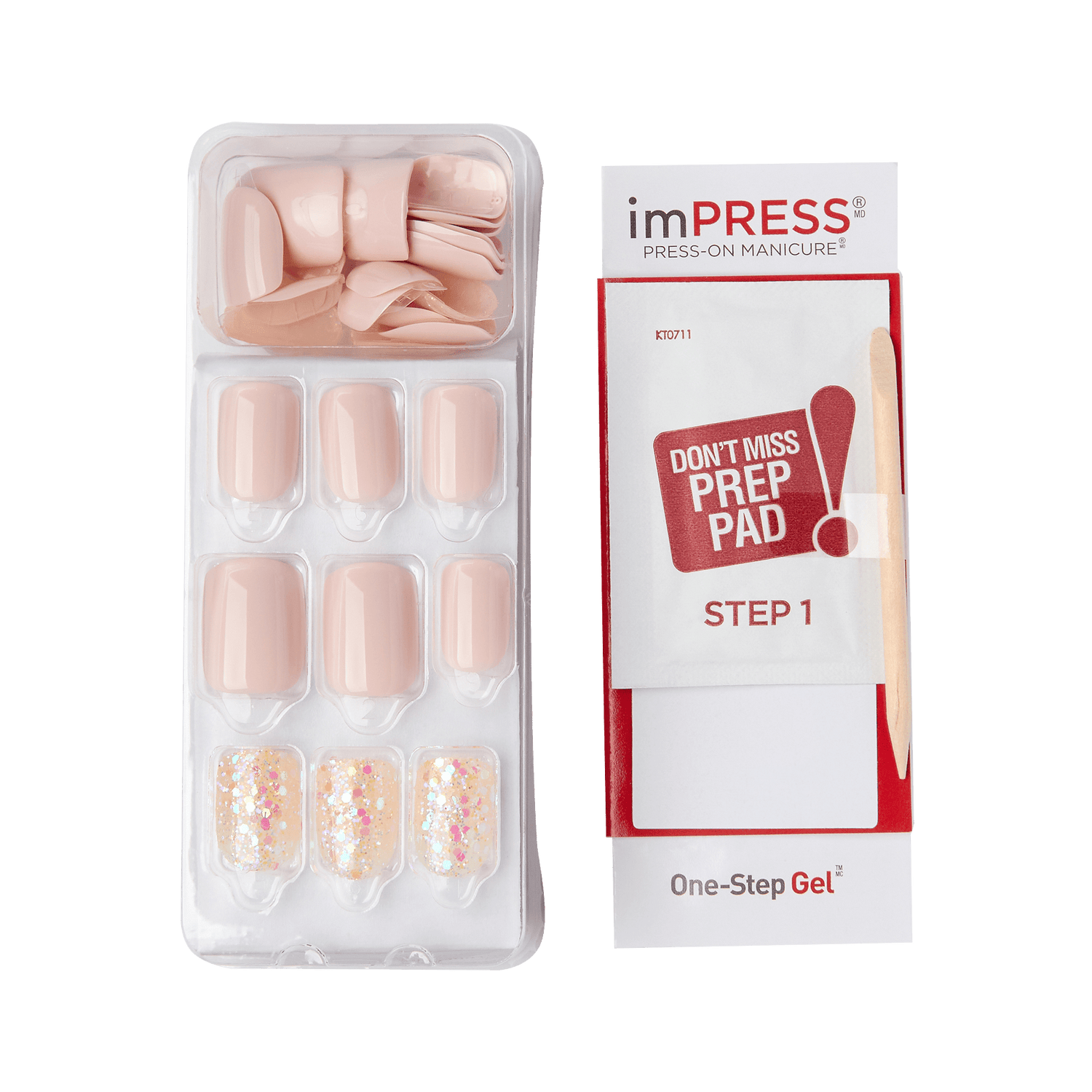 Press-on nail set with nude and glitter designs in plastic tray, including a wooden cuticle stick and prep pad labeled \