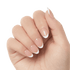 Hand with press-on gel nails in a natural nude shade featuring white French tips in varied almond and coffin shapes.
