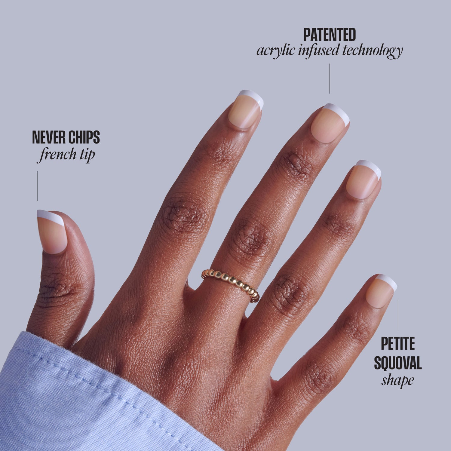 French tip acrylic nails with patented acrylic infused technology on brown skin hand.