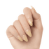 Hand showing long, almond-shaped press on gel nails in a glossy pale yellow shade called \